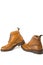 Shoes Concepts. Premium Tanned Brogue Derby Boots of Calf Leather with Rubber Sole. Isolated Over Pure White. Shoes Placed in Lin