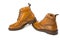 Shoes Concepts. Premium Tanned Brogue Derby Boots of Calf Leather with Rubber Sole. Isolated Over Pure White. Shoes placed In Line