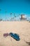 Shoes and flip flops on the beach around Long Beach, California. California is known as warm and nice wether. The world is big eno