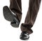 Shoes and legs of businessman caution step
