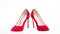 Shoes made out of red suede on white background, isolated. Footwear for women with thin high heels. Elegant stiletto