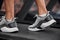 Shoes, man and running on treadmill in gym for exercise, healthy fitness and cardio workout. Closeup athlete, feet and