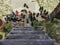 Shoes scattered at the bottom of a rustic stairs -  customary for Asians to take off their shoes before entering ones house