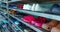 Shoes of workers and visitors in the shoe rack of the factory. Many shoes for men and women are organized on the shoe rack.