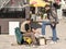 Shoeshiner polishing the shoes of a white young man in the Skopje bazar in the capital city of Macedonia