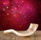 Shofar (horn) on wooden table. rosh hashanah (jewish holiday) concept . traditional holiday symbol.