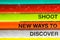Shoot discover ways text rusty close up view in vivid colorful abstract background