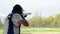 Shooter firing a rifle in skeet champioship