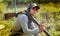 Shooter from a gun practicing shooting on plates in nature