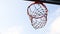 Shooting basketball ball into the basket in layup