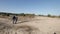 Shooting Couple wolking on sand