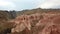 Shooting from a drone, top view of Charyn canyon. Red canyon, Martian view. Sandy and stone edge of the canyon