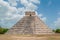Shooting of the Mayan Pyramid of Kukulkan, with visible the restored side and the original side