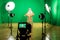 Shooting the movie on a green screen. The chroma key. Studio videography. Actor in theatrical costume