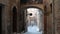 Shooting in POV of a beautiful alley in the historic center of Siena.