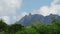 shooting from top to bottom the peaks of mountains and jungles of Mauritius, the sky in clouds