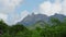 shooting from top to bottom the peaks of mountains and jungles of Mauritius, the sky in clouds