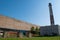 Shop blacksmithing plant. Huge chimney of an industrial plant that produces. against the blue sky