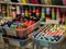 Shop of fabrics and accessories for sewing clothes. Lots of multi-colored bobbins of sewing thread in plastic boxes