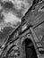 Shop Front And Red Sandstone Tenement Close Entrance - Black And White.