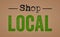 Shop local written on a retro paper background