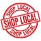 SHOP LOCAL written word on red stamp sign