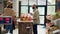 Shop owner shows pasta types to client