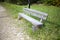 A shop in the park.  Wooden bench for outdoor recreation.