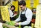 Shop people standing near cabbage in grocery