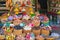 Shop selling colorful goods from souvenirs, spices, stones to fresh produce in baskes