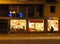 Shop window lighting at night, passing girl, streetview, discount numbers, sale,