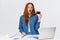 Shopaholic excited buy new things online. Thrilled and shook good-looking redhead female holding credit card look amused