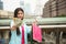 shopaholic girl with us banknotes in city