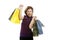 Shopaholic woman with colorful bags over white