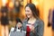 Shopper paying on line with credit card in a mall