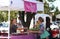 Shoppers buy goods at a farmers and artisan market.