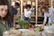 Shoppers Buying Fresh Fruit And Vegetables In Sustainable Plastic Free Grocery Store