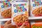 Shoppers hand holding a  package of General MIlls Cinnamon Toast Crunch brand  Wheat and rice cereal