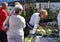 Shoppers inspect goods at a farmers and artisan market.