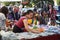 Shoppers inspect goods at a farmers and artisan market.