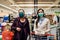 Shoppers with masks buying for groceries due to coronavirus pandemic in grocery store.COVID-19 food shopping.Quarantine