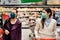 Shoppers with masks buying for groceries due to coronavirus pandemic in grocery store.COVID-19 food shopping.Quarantine