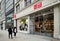 Shoppers pass a closed Uni Qlo shop on Oxford Street, London