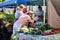 Shoppers walk through a farmers and artisan market.