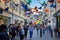 Shoppers walking under  a canopy of brightly coloured butterflies in Southgate Shopping Centre in Bath, Avon, UK