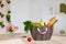 Shopping bag full of fresh food on kitchen desk