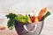 Shopping bag full of fresh food on kitchen desk