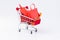Shopping bag full on shopping cart on white background
