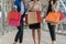 Shopping bag in the hands of women in modern city