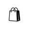 Shopping bag icon in black. Eco paper bag. Handbag icon. Vector on isolated white background. EPS 10